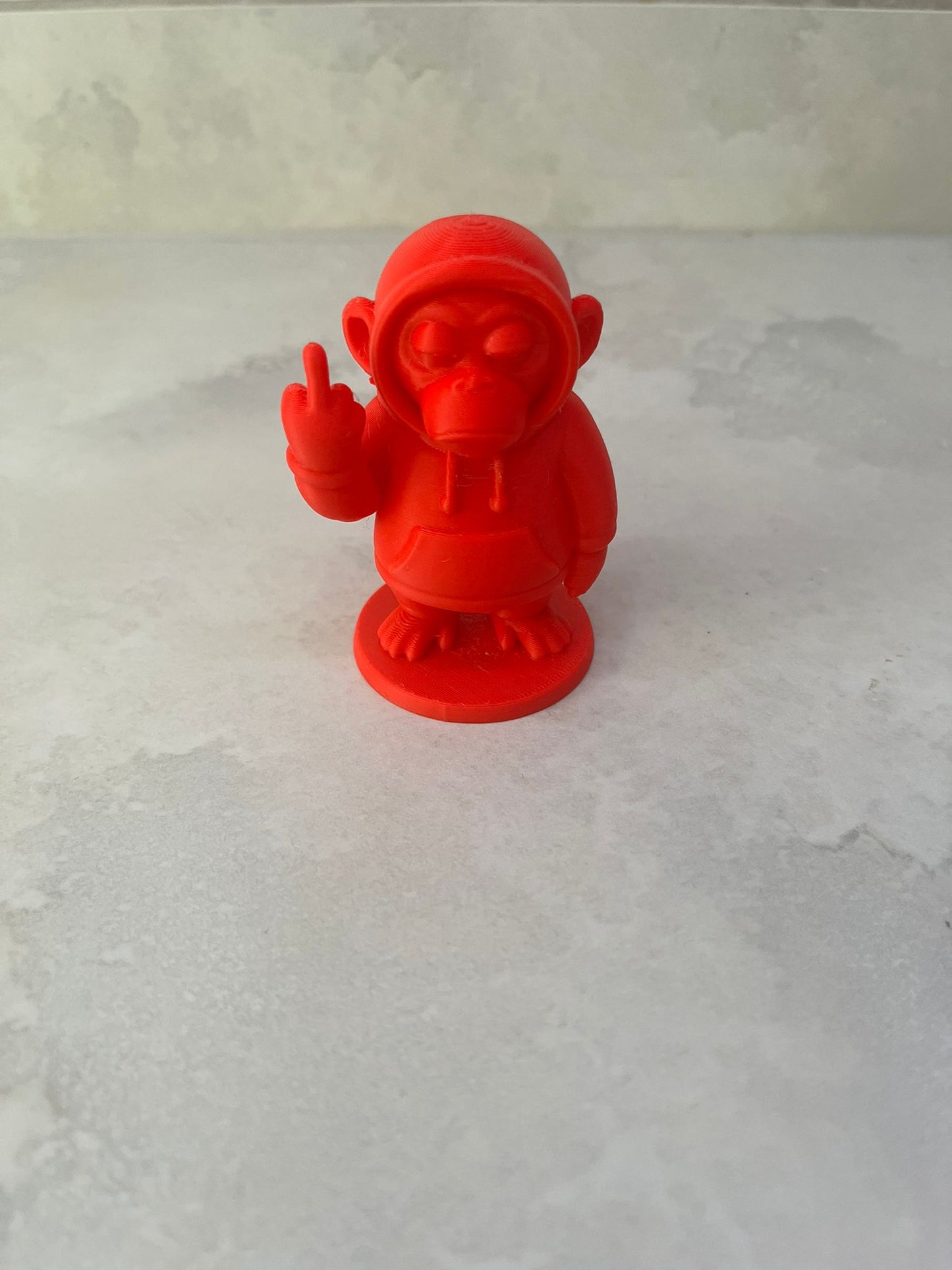 Monkey in a hoody figure showing middle finger (other colours available)