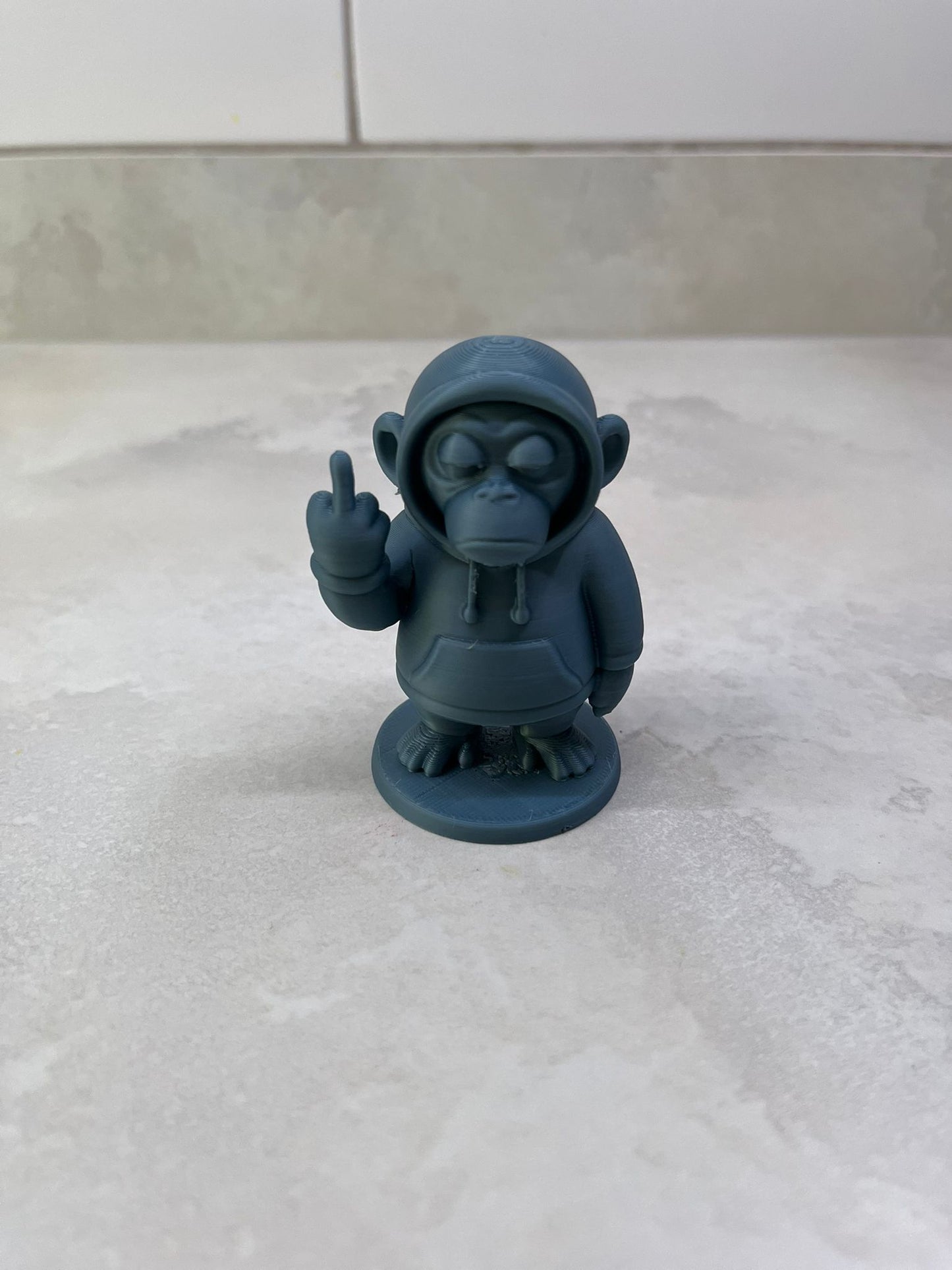 Monkey in a hoody figure showing middle finger (other colours available)